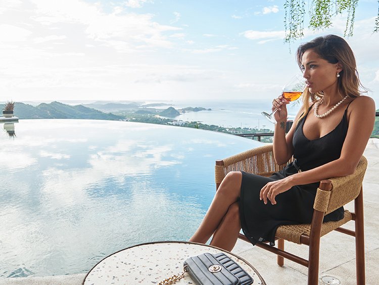 woman drinking a cocktail